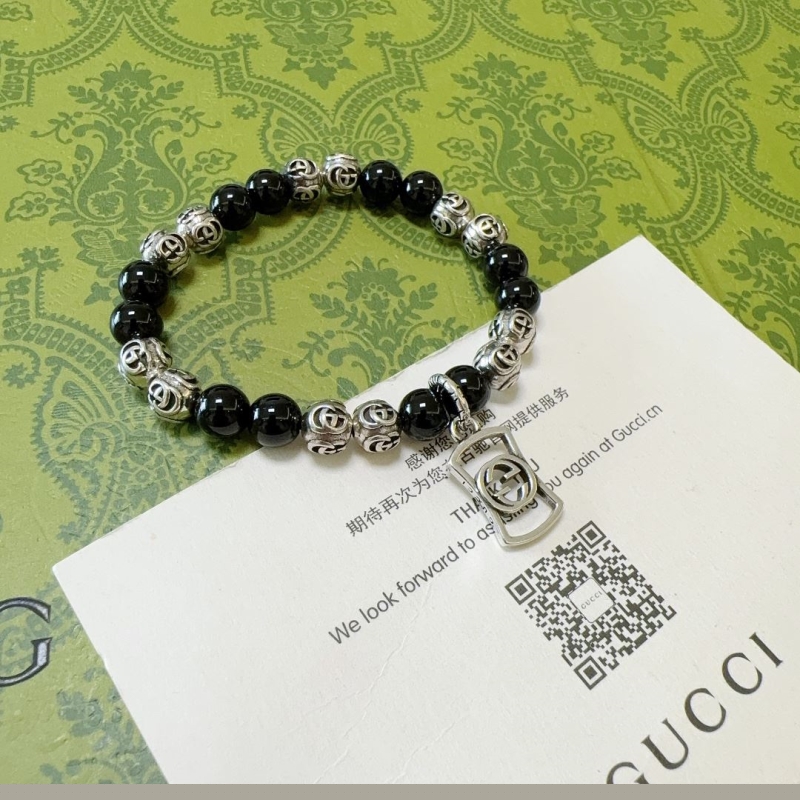 G*u*i bracelets
